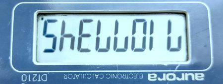 Calculator display showing figures to spell the word Shell Oil