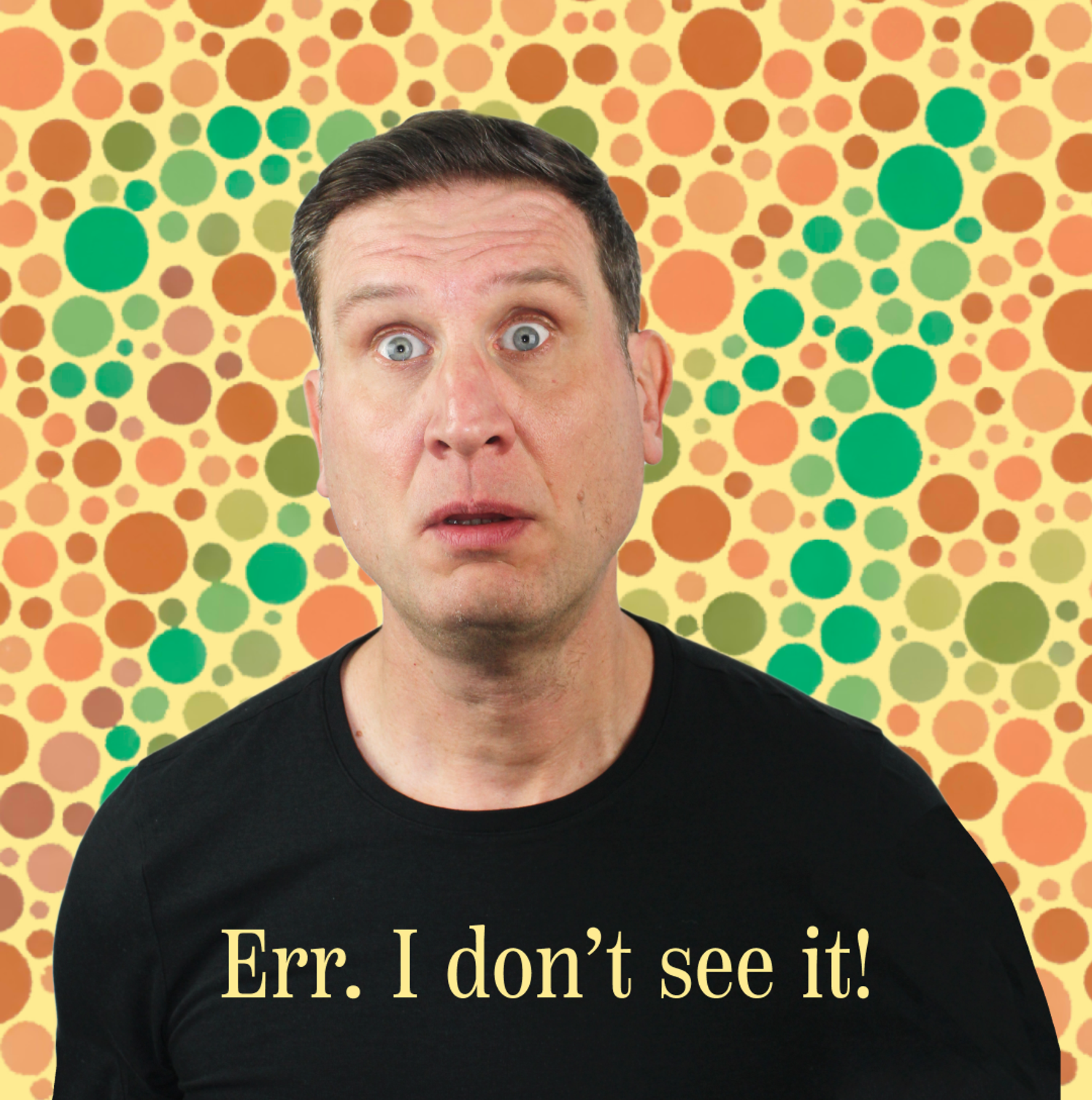 A middle-aged white male with a confused expression on his face. Behind him are varying sized circles in different shades of greens and reds covering the background. The dots are from a Ishihara colour blindness test.