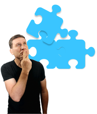 Simon (a clean shaven middle-aged white male with brown hair) wearing a black t-and a poignantly look on his face. He is staring at a large blue icon of three puzzle pieces with his finger rested on his mouth.